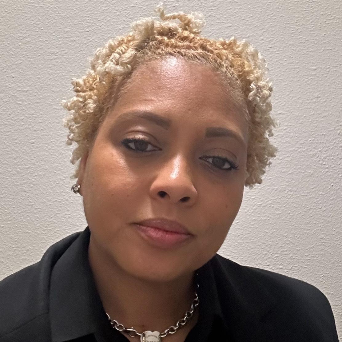 TUNISHA M. HOLMES